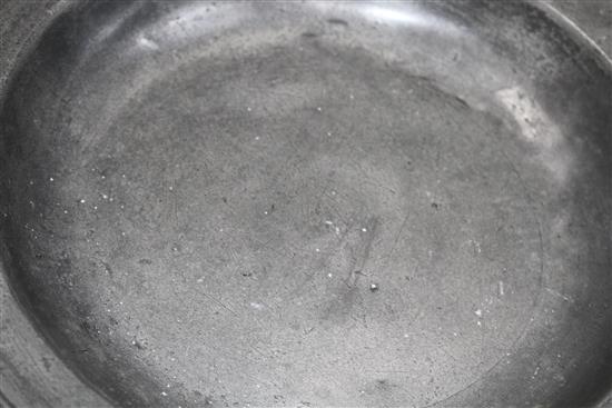 A George III pewter charger by William Hogg of Newcastle, diameter 34cm and a dished plate 27cm